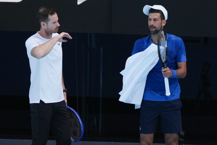 Serbia's Novak Djokovic talks with his coach Andy Murray, left, during a practice session ahead of the Australian Open tennis championship in Melbourne, Australia, Thursday, Jan. 9, 2025. (AP Photo/Mark Baker)