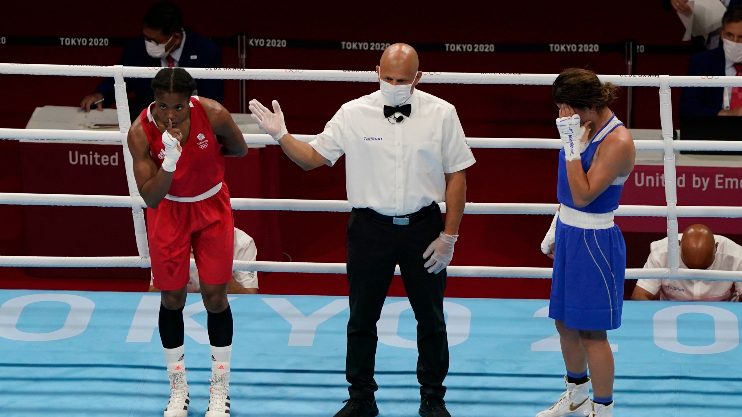 FILE -Caroline Dubois, of Great Britain, left, reacts after defeating Donjeta Sadiku, of Kosovo, right, in a light weight (60kg) preliminary boxing match at the 2020 Summer Olympics, July 27, 2021, in Tokyo, Japan. (AP Photo/ Frank Franklin II, File)