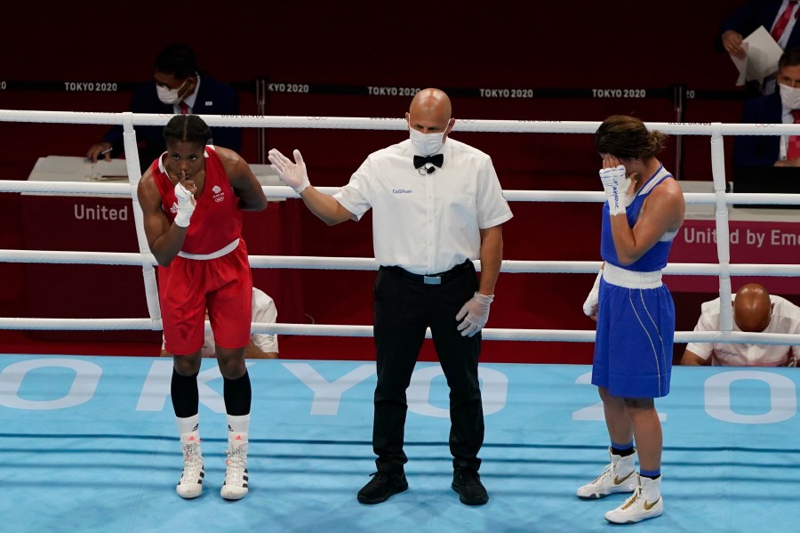 FILE -Caroline Dubois, of Great Britain, left, reacts after defeating Donjeta Sadiku, of Kosovo, right, in a light weight (60kg) preliminary boxing match at the 2020 Summer Olympics, July 27, 2021, in Tokyo, Japan. (AP Photo/ Frank Franklin II, File)