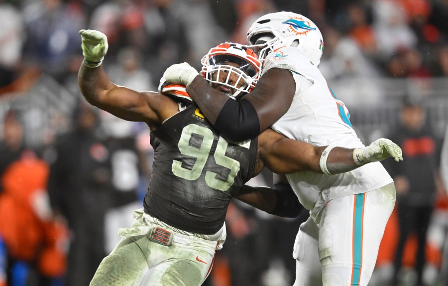 Cleveland Browns defensive end Myles Garrett (95) is pressured by Miami Dolphins offensive tackle Patrick Paul, right, during the second half of an NFL football game Sunday, Dec. 29, 2024, in Cleveland. (AP Photo/David Richard)