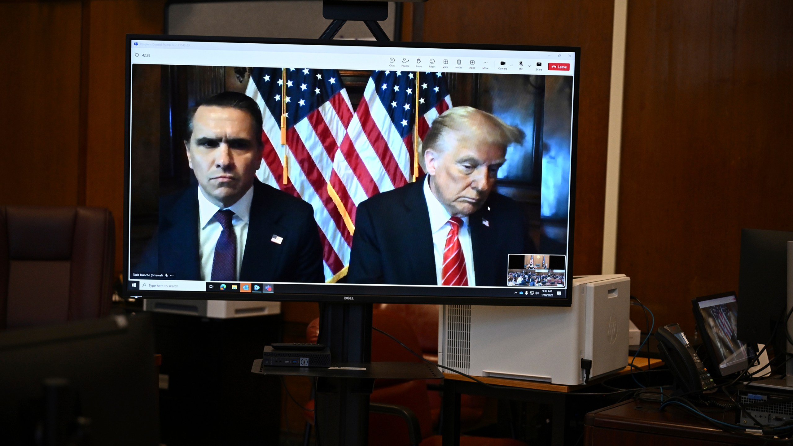 Attorney Todd Blanche and President-elect Donald Trump, seen on a television screen, appear virtually for sentencing for Trump's hush money conviction in a Manhattan courtroom on Friday, Jan. 10, 2025 in New York. (Angela Weiss/Pool Photo via AP)