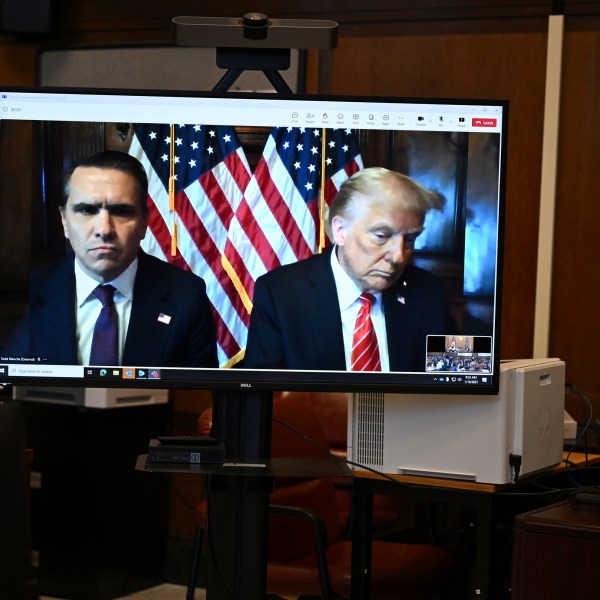 Attorney Todd Blanche and President-elect Donald Trump, seen on a television screen, appear virtually for sentencing for Trump's hush money conviction in a Manhattan courtroom on Friday, Jan. 10, 2025 in New York. (Angela Weiss/Pool Photo via AP)