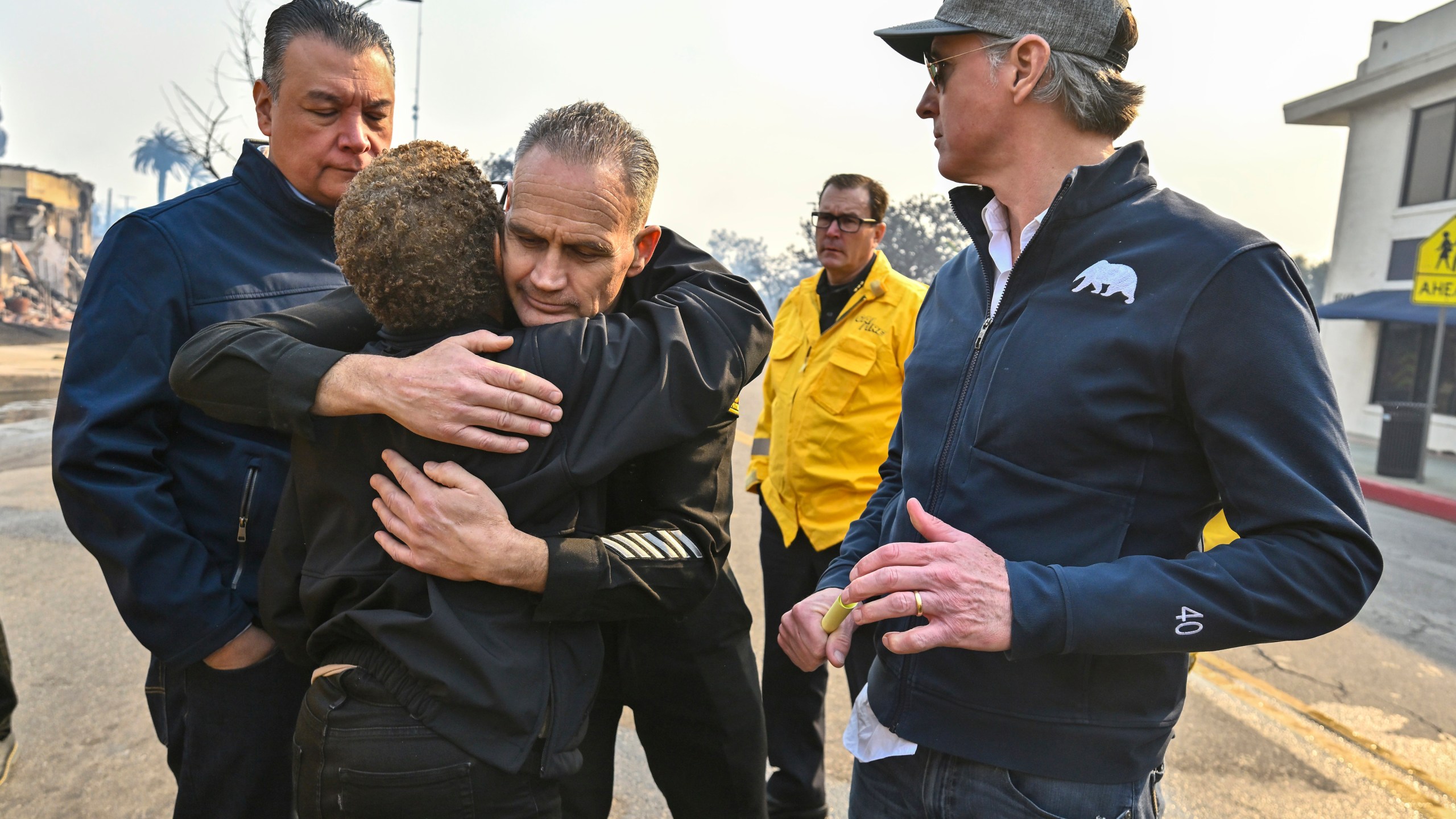 Los Angeles City Fire Captain Frank Lima, greets Los Angeles Mayor Karen Bass, as she joins California Governor Gavin Newsom, right, and Senator Alex Padilla, D-Calif., while surveying damage during the Palisades Fire Wednesday, Jan. 8, 2025, in Pacific Palisades, Calif. (Jeff Gritchen/The Orange County Register via AP)