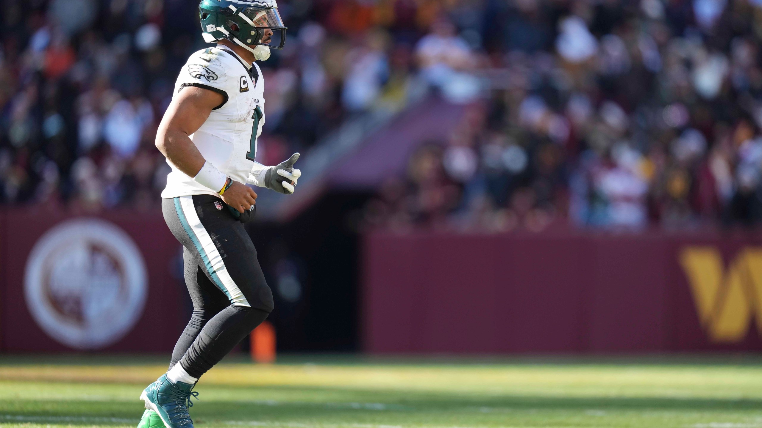 Philadelphia Eagles quarterback Jalen Hurts (1) walking off the field during the first half of an NFL football game against the Washington Commanders, Sunday, Dec. 22, 2024, in Landover, Md. (AP Photo/Stephanie Scarbrough)