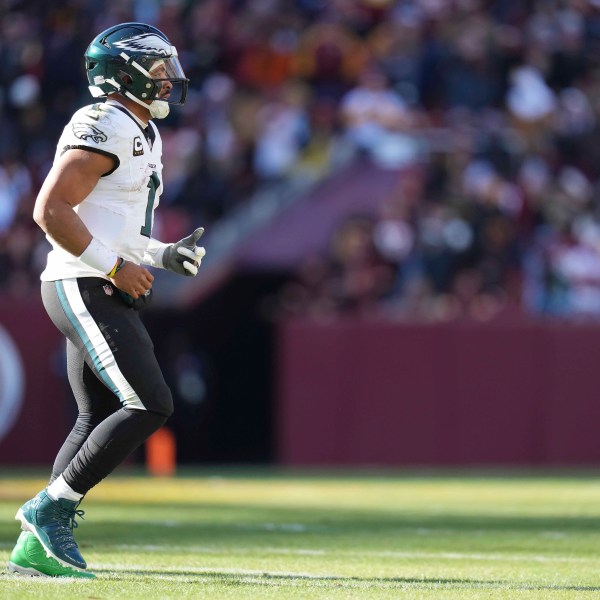 Philadelphia Eagles quarterback Jalen Hurts (1) walking off the field during the first half of an NFL football game against the Washington Commanders, Sunday, Dec. 22, 2024, in Landover, Md. (AP Photo/Stephanie Scarbrough)