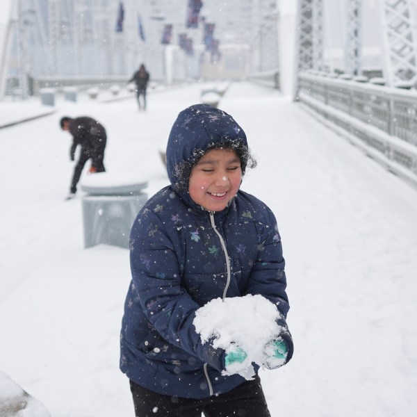 Joselyn Catlan, 9, plays in the snow Friday, Jan 10, 2025, in Nashville, Tenn. (AP Photo/George Walker IV)