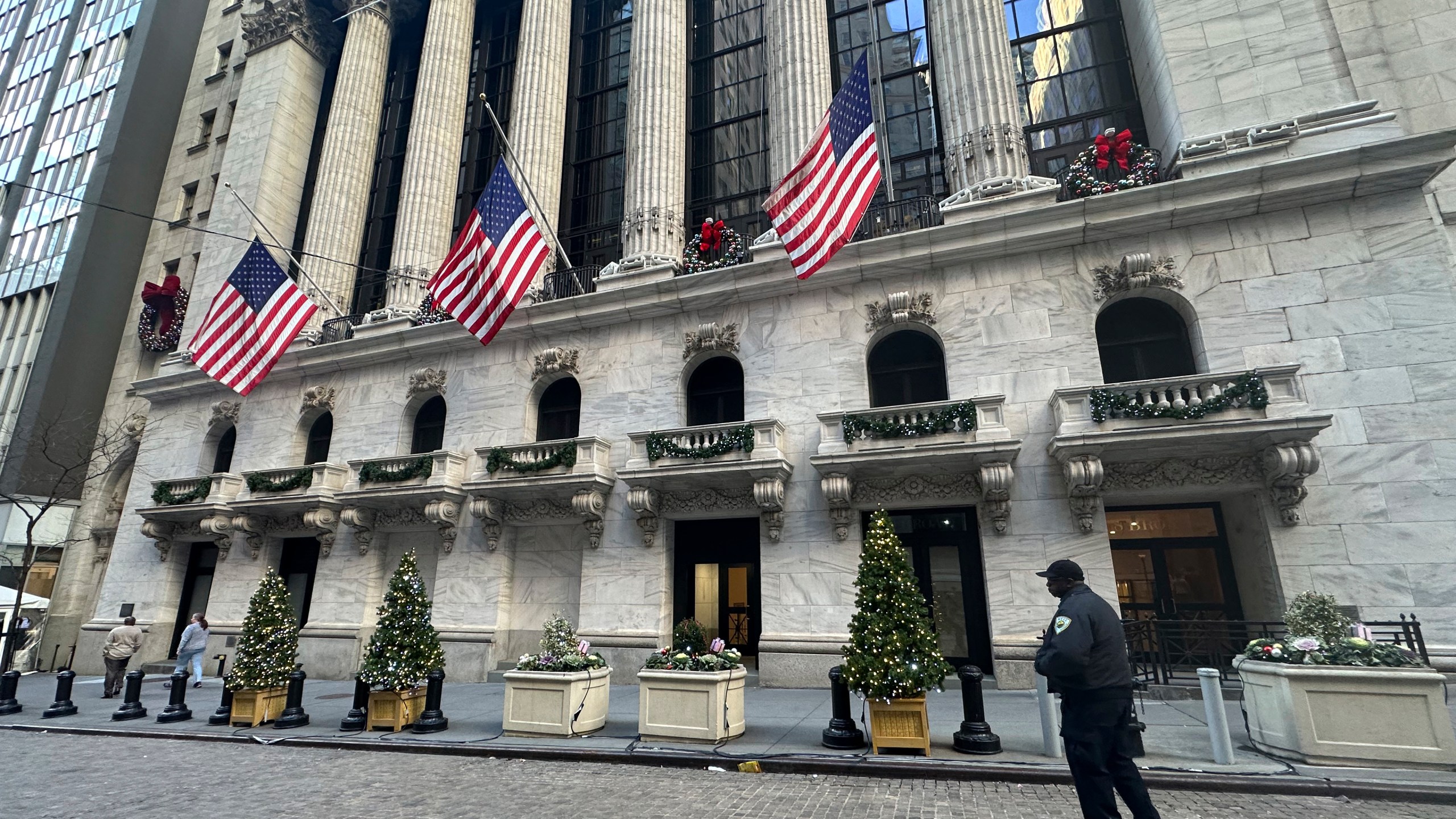 FILE - The New York Stock Exchange is shown in New York's Financial District on Dec. 31, 2024. American flags flew at half-staff there following the death of former U.S. president Jimmy Carter. (AP Photo/Peter Morgan, File)