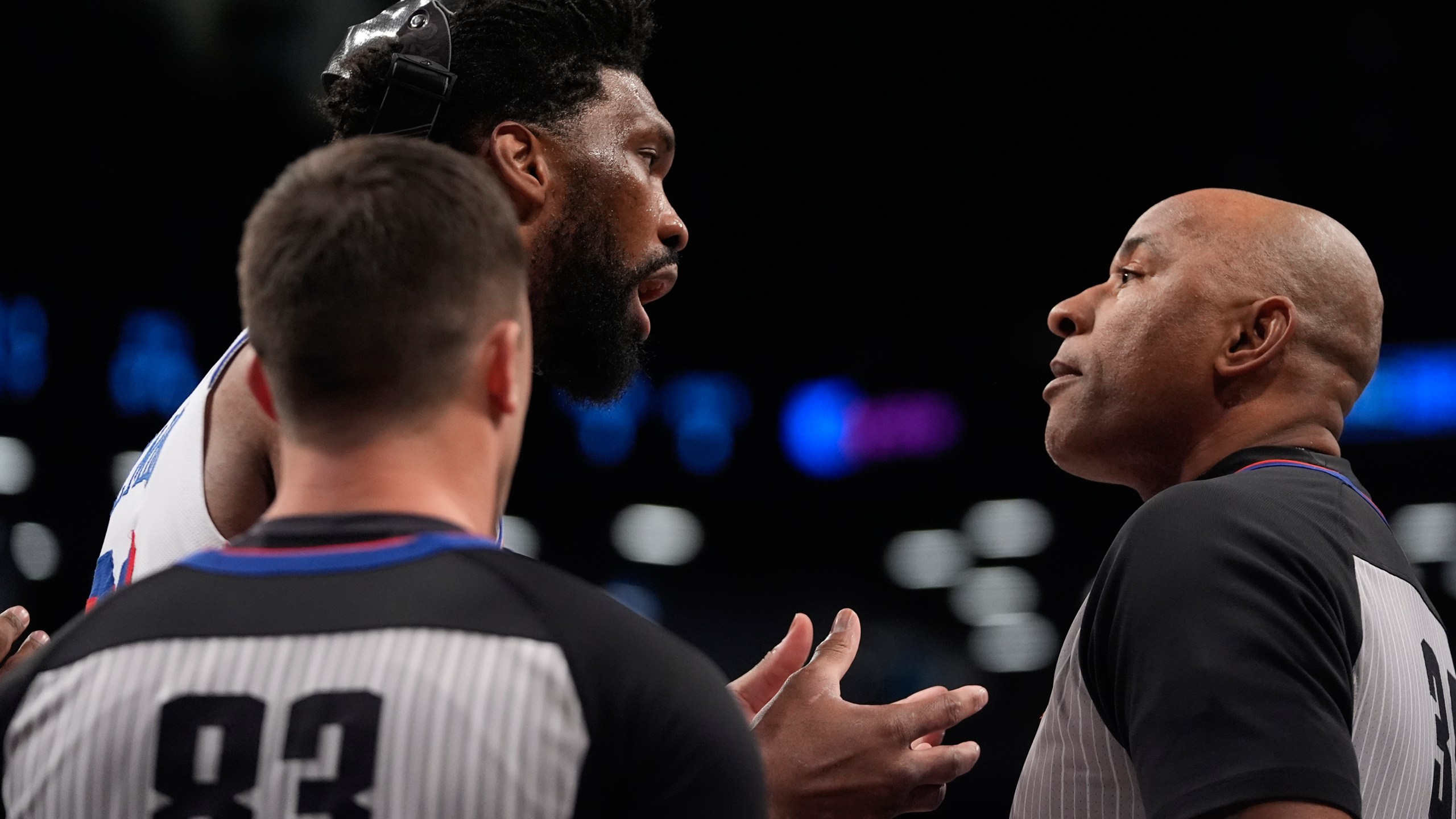 Philadelphia 76ers' Joel Embiid, left, argues a call with referee Kevin Cutler (34) during the first half of an NBA basketball game against the Brooklyn Nets Saturday, Jan. 4, 2025, in New York. (AP Photo/Frank Franklin II)