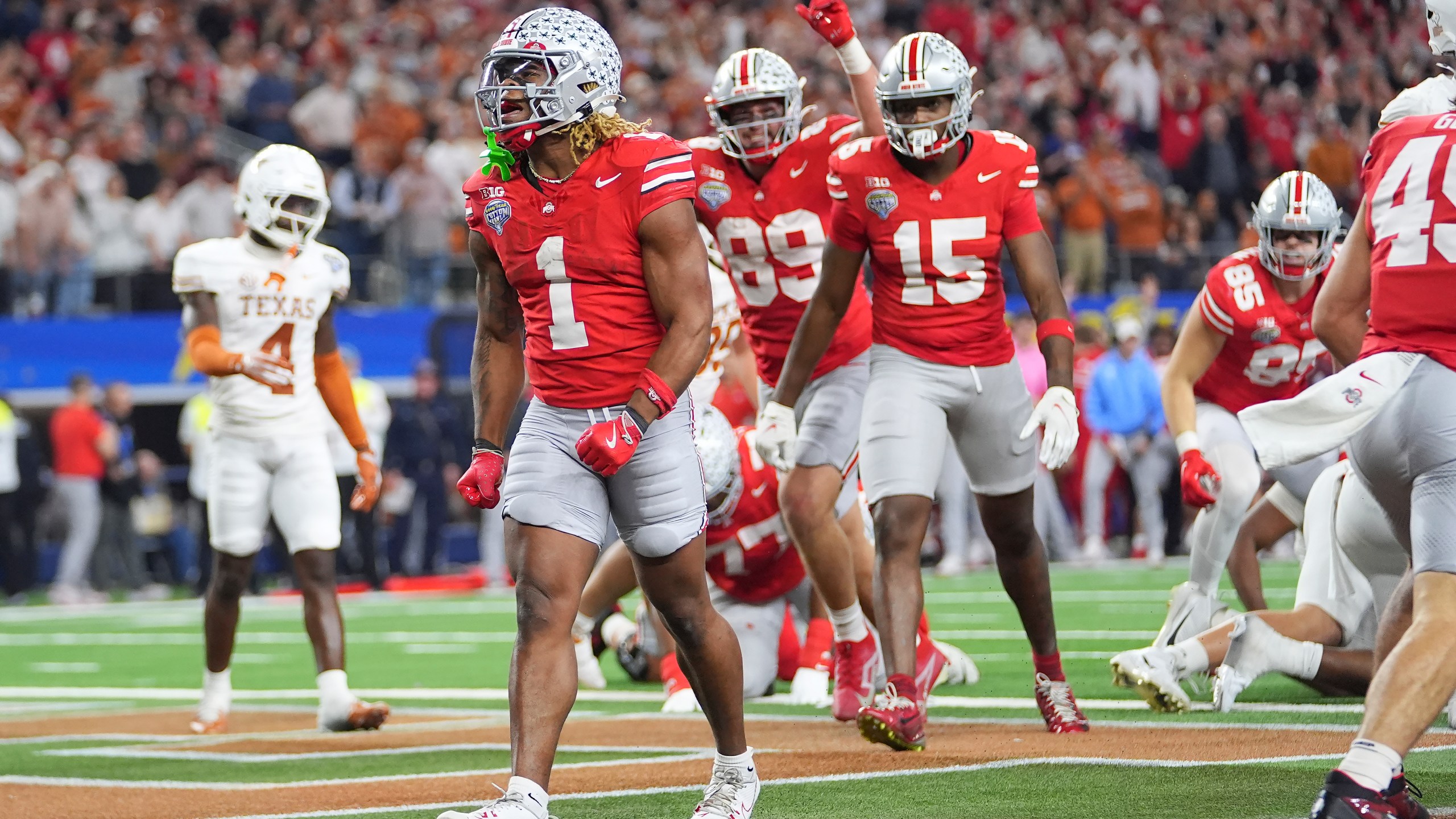 Ohio State running back Quinshon Judkins (1) reacts after scoring against Texas during the second half of the Cotton Bowl College Football Playoff semifinal game, Friday, Jan. 10, 2025, in Arlington, Texas. (AP Photo/Julio Cortez)