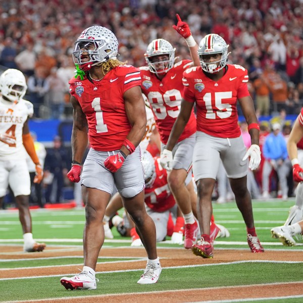 Ohio State running back Quinshon Judkins (1) reacts after scoring against Texas during the second half of the Cotton Bowl College Football Playoff semifinal game, Friday, Jan. 10, 2025, in Arlington, Texas. (AP Photo/Julio Cortez)