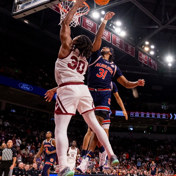 Auburn forward Chaney Johnson (31) blocks a shot by South Carolina forward Collin Murray-Boyles (30) during the second half of an NCAA college basketball game, Saturday, Jan. 11, 2025, in Columbia, S.C. (AP Photo/Scott Kinser)