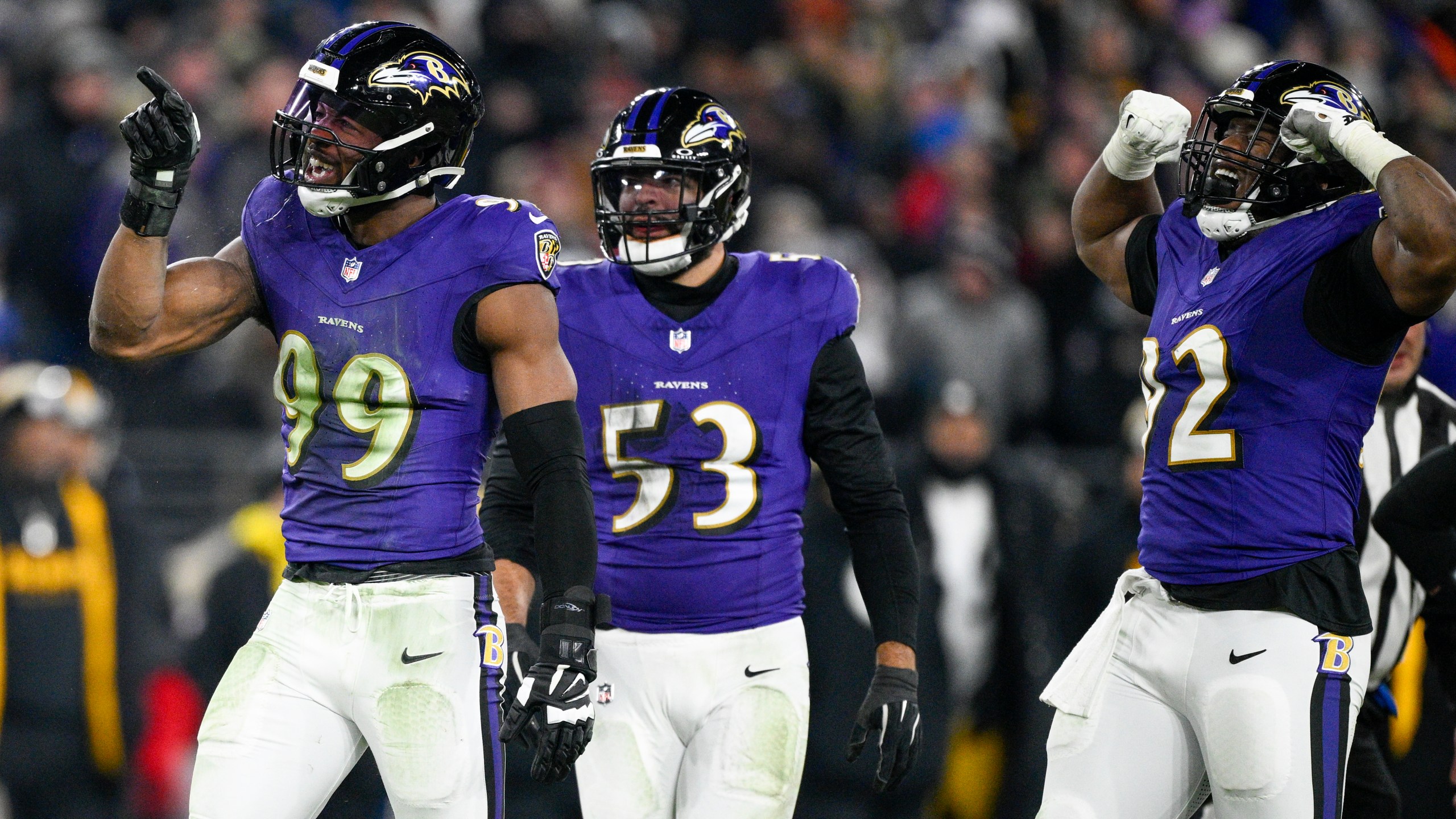 Baltimore Ravens linebacker Odafe Oweh (99) celebrates a sack with teammates linebacker Kyle Van Noy (53) and defensive tackle Nnamdi Madubuike (92) during the second half of an NFL wild-card playoff football game against the Pittsburgh Steelers, Saturday, Jan. 11, 2025, in Baltimore. (AP Photo/Nick Wass)