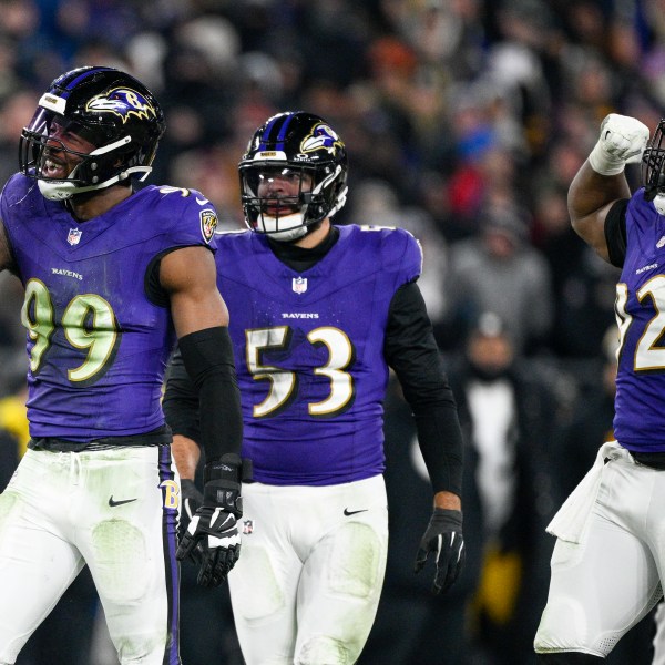 Baltimore Ravens linebacker Odafe Oweh (99) celebrates a sack with teammates linebacker Kyle Van Noy (53) and defensive tackle Nnamdi Madubuike (92) during the second half of an NFL wild-card playoff football game against the Pittsburgh Steelers, Saturday, Jan. 11, 2025, in Baltimore. (AP Photo/Nick Wass)