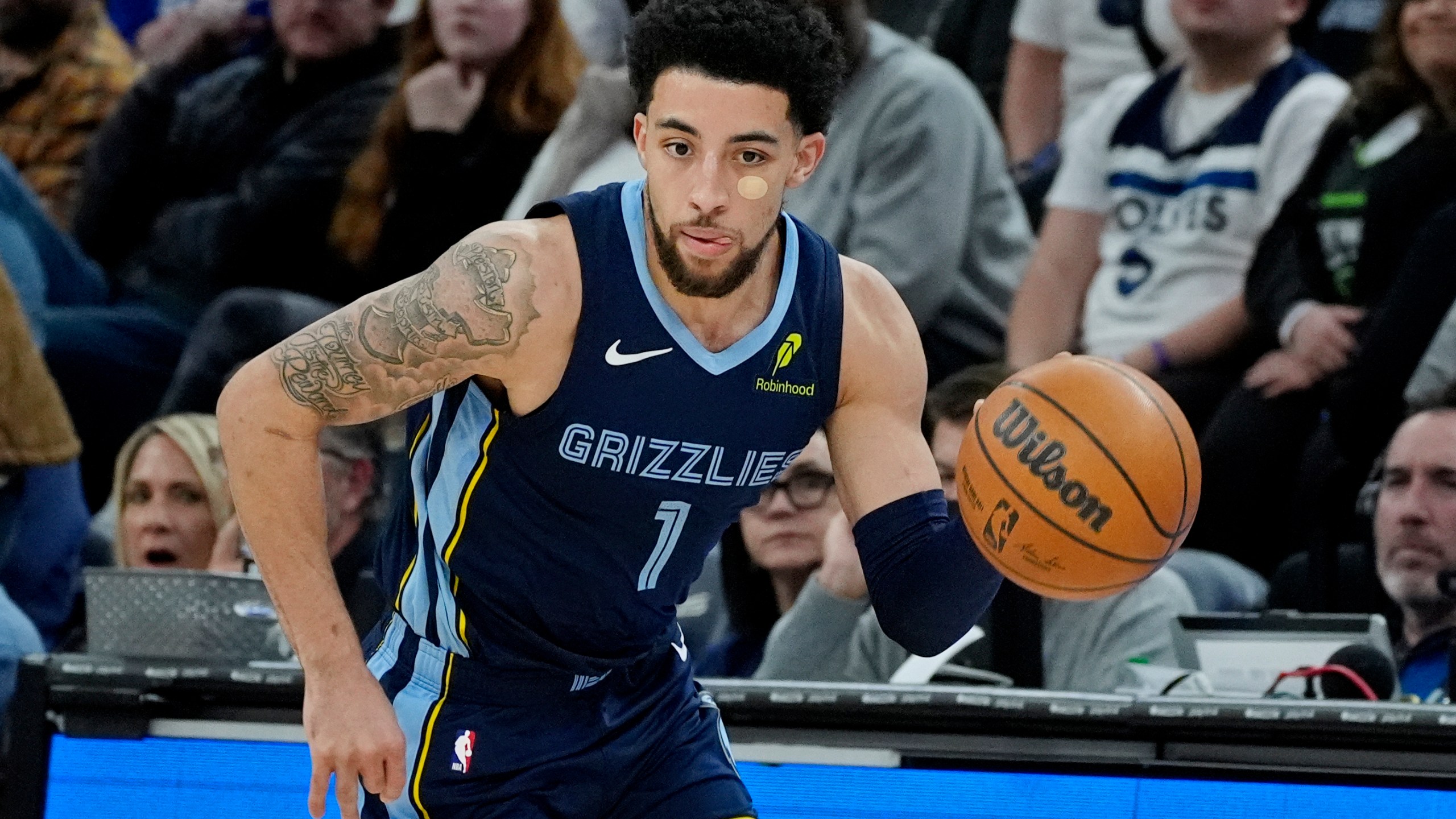 Memphis Grizzlies guard Scotty Pippen Jr. steals the ball from the Minnesota Timberwolves and heads up court in the second quarter of an NBA basketball game Saturday, Jan. 11, 2025, in Minneapolis. (AP Photo/Bruce Kluckhohn)