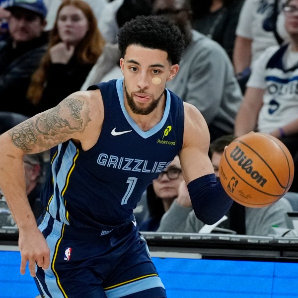 Memphis Grizzlies guard Scotty Pippen Jr. steals the ball from the Minnesota Timberwolves and heads up court in the second quarter of an NBA basketball game Saturday, Jan. 11, 2025, in Minneapolis. (AP Photo/Bruce Kluckhohn)