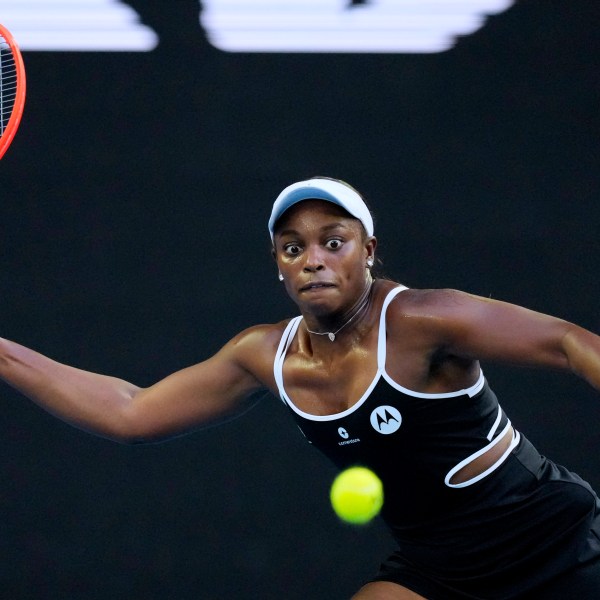 Sloane Stephens of the U.S. plays a forehand return to Aryna Sabalenka of Belarus during their first round match at the Australian Open tennis championship in Melbourne, Australia, Sunday, Jan. 12, 2025. (AP Photo/Vincent Thian)