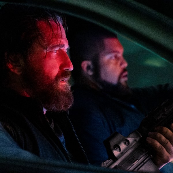 This image released by Lionsgate shows Gerard Butler, left, and O'Shea Jackson Jr. in a scene from "Den of Thieves 2: Pantera." (Rico Torres/Lionsgate via AP)