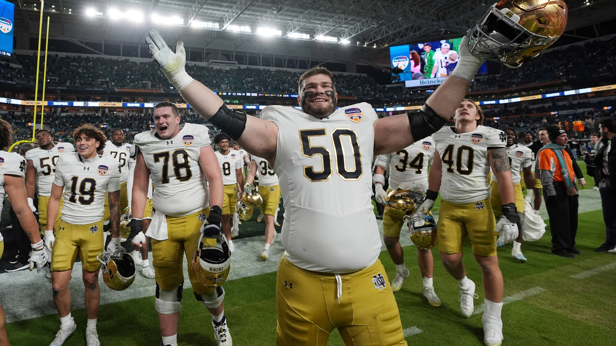 Notre Dame offensive lineman Rocco Spindler (50) celebrates at the end of the Orange Bowl College Football Playoff semifinal game against Penn State, Thursday, Jan. 9, 2025, in Miami Gardens, Fla. (AP Photo/Rebecca Blackwell)