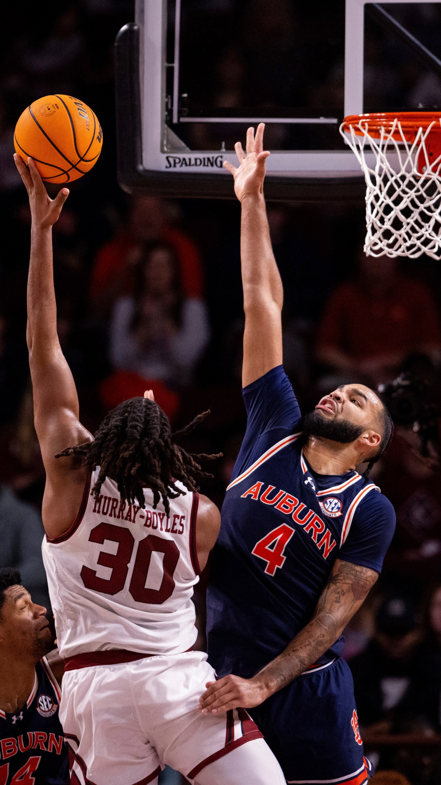 Carolina forward Collin Murray-Boyles, left, shoots over Auburn's Johni Broome (4) during the first half of an NCAA college basketball game on Saturday, Jan. 11, 2025, in Columbia, S.C. (AP Photo/Scott Kinser)