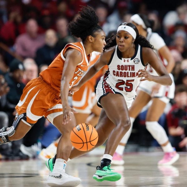 Texas guard Rori Harmon (3) drives against South Carolina guard Raven Johnson (25) during the first half of an NCAA college basketball game in Columbia, S.C., Sunday, Jan. 12, 2025. (AP Photo/Nell Redmond)