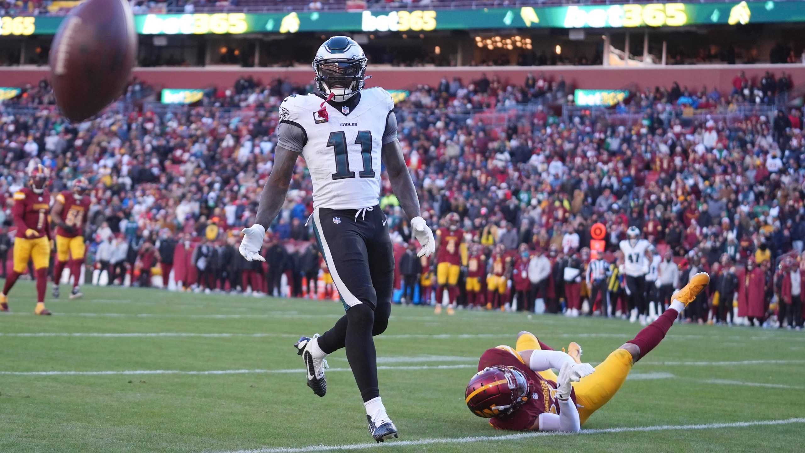 Washington Commanders cornerback Marshon Lattimore (23) is called for pass interference against Philadelphia Eagles wide receiver A.J. Brown (11) during the second half of an NFL football game, Sunday, Dec. 22, 2024, in Landover, Md. (AP Photo/Stephanie Scarbrough)