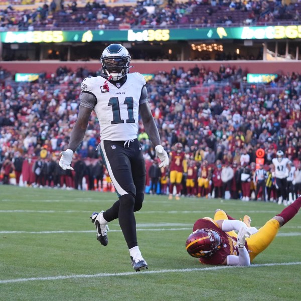 Washington Commanders cornerback Marshon Lattimore (23) is called for pass interference against Philadelphia Eagles wide receiver A.J. Brown (11) during the second half of an NFL football game, Sunday, Dec. 22, 2024, in Landover, Md. (AP Photo/Stephanie Scarbrough)