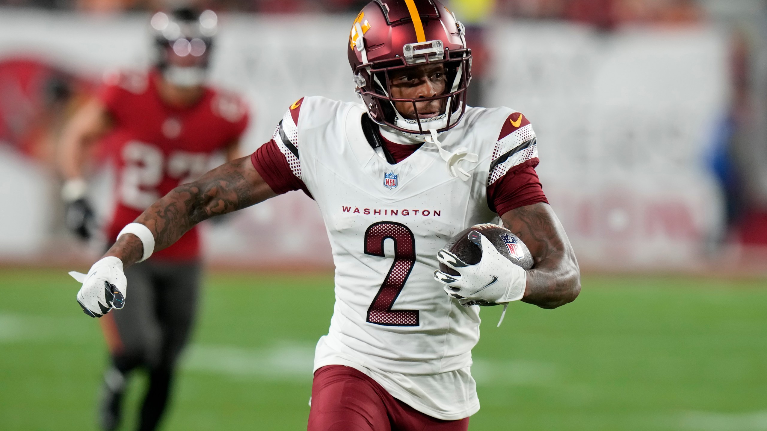 Washington Commanders wide receiver Dyami Brown (2) runs against the Tampa Bay Buccaneers during the second half of an NFL wild-card playoff football game in Tampa, Fla., Sunday, Jan. 12, 2025. (AP Photo/Chris O'Meara)