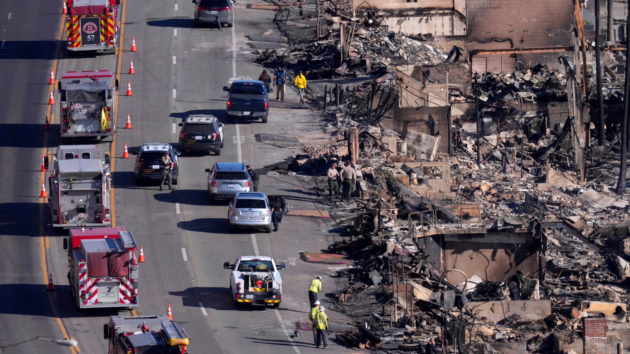 Homes along the Pacific Coast Highway are seen burned by the Palisades Fire, Sunday, Jan. 12, 2025, in Malibu, Calif. (AP Photo/Mark J. Terrill)