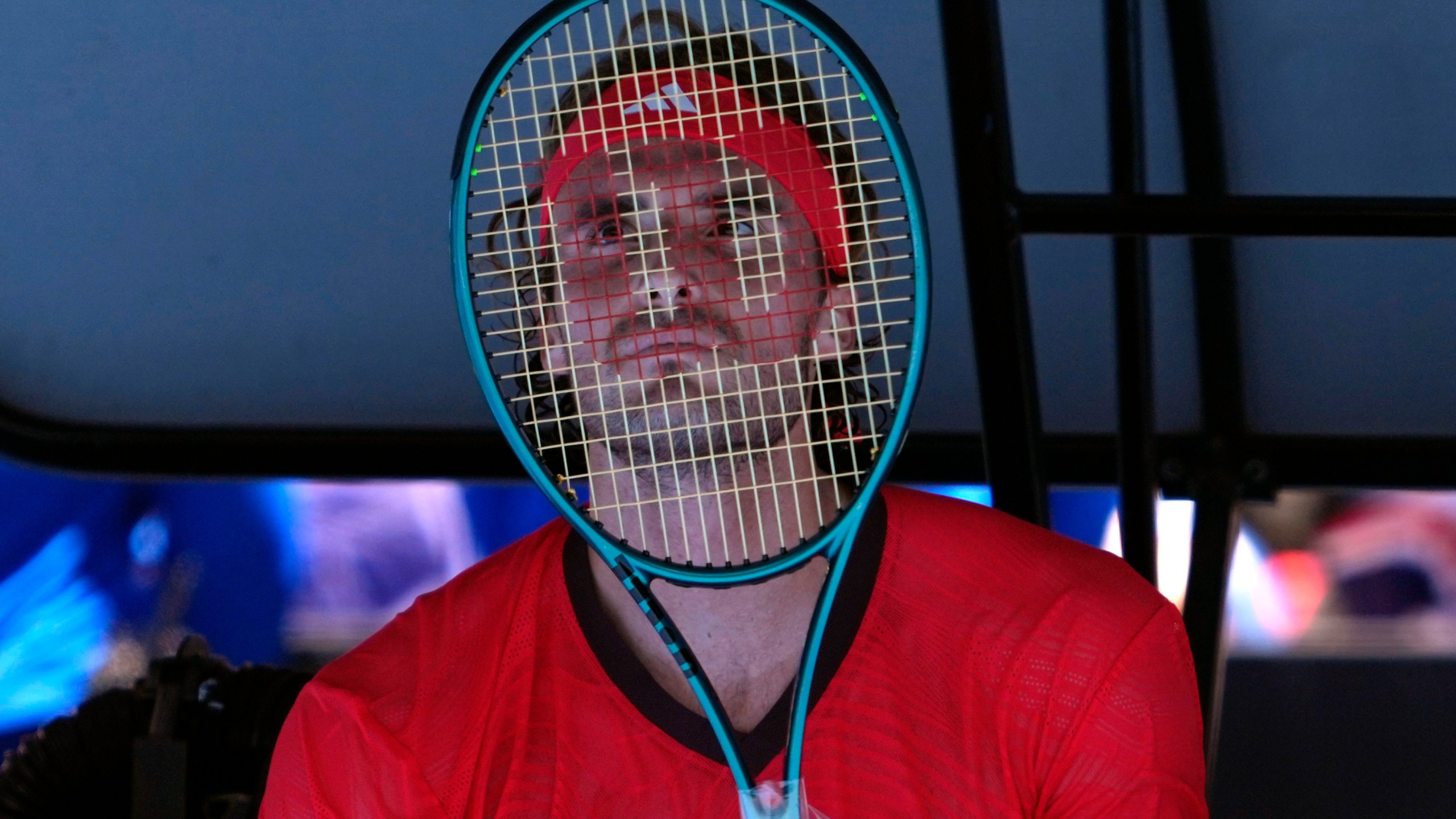 Stefanos Tsitsipas of Greece reacts during a break in his first round match against Alex Michelsen of the U.S. at the Australian Open tennis championship in Melbourne, Australia, Monday, Jan. 13, 2025. (AP Photo/Ng Han Guan)