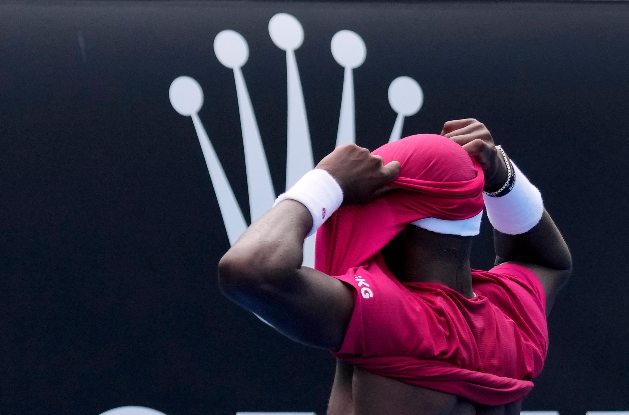 Frances Tiafoe of the U.S. celebrates after defeating Arthur Rinderknech of France in their first round match at the Australian Open tennis championship in Melbourne, Australia, Monday, Jan. 13, 2025. (AP Photo/Vincent Thian)