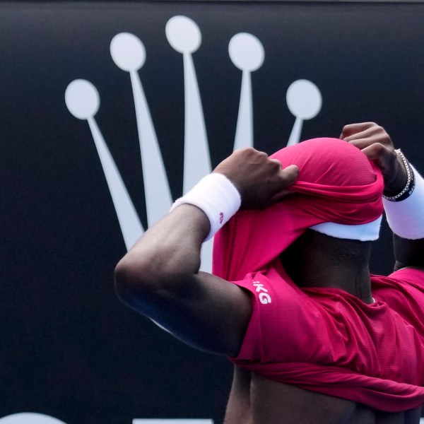 Frances Tiafoe of the U.S. celebrates after defeating Arthur Rinderknech of France in their first round match at the Australian Open tennis championship in Melbourne, Australia, Monday, Jan. 13, 2025. (AP Photo/Vincent Thian)