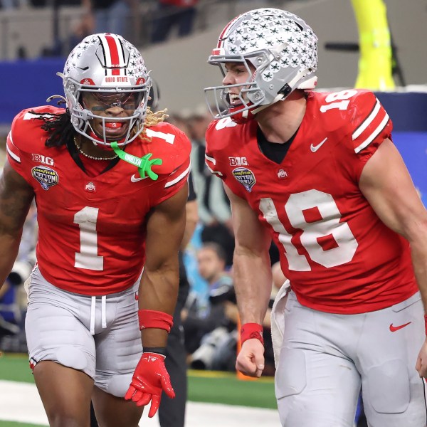 Ohio State running back Quinshon Judkins (1) celebrates after scoring a touchdown with quarterback Will Howard (18) during the second half of the Cotton Bowl College Football Playoff semifinal game against Texas, Friday, Jan. 10, 2025, in Arlington, Texas. (AP Photo/Gareth Patterson)