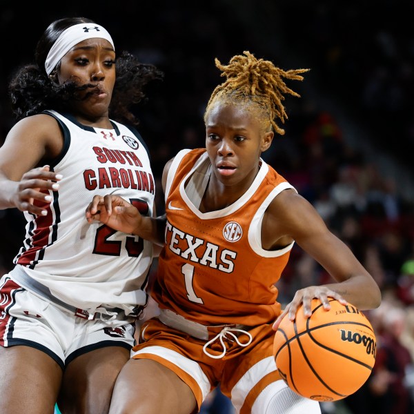 Texas guard Bryanna Preston (1) drives against South Carolina guard Raven Johnson during the second half of an NCAA college basketball game in Columbia, S.C., Sunday, Jan. 12, 2025. (AP Photo/Nell Redmond)