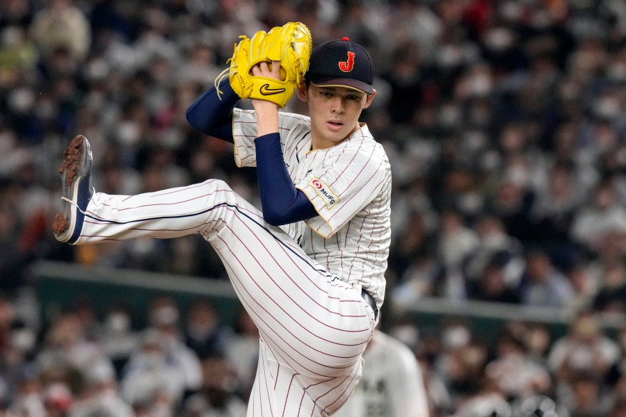 FILE - Roki Sasaki, of Japan, pitches during their Pool B game against the Czech Republic at the World Baseball Classic at the Tokyo Dome in Japan Saturday, March 11, 2023. (AP Photo/Eugene Hoshiko, File)