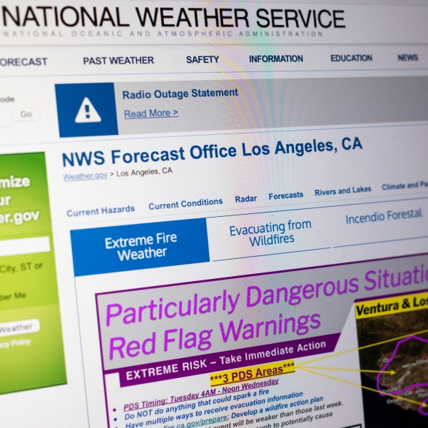 A "Particularly Dangerous Situation" red flag warning appears on the National Weather Service's website for Los Angeles due to the extreme risk of wildfires in the region, Monday, Jan. 13, 2025. (AP Photo/Rachel Leathe)