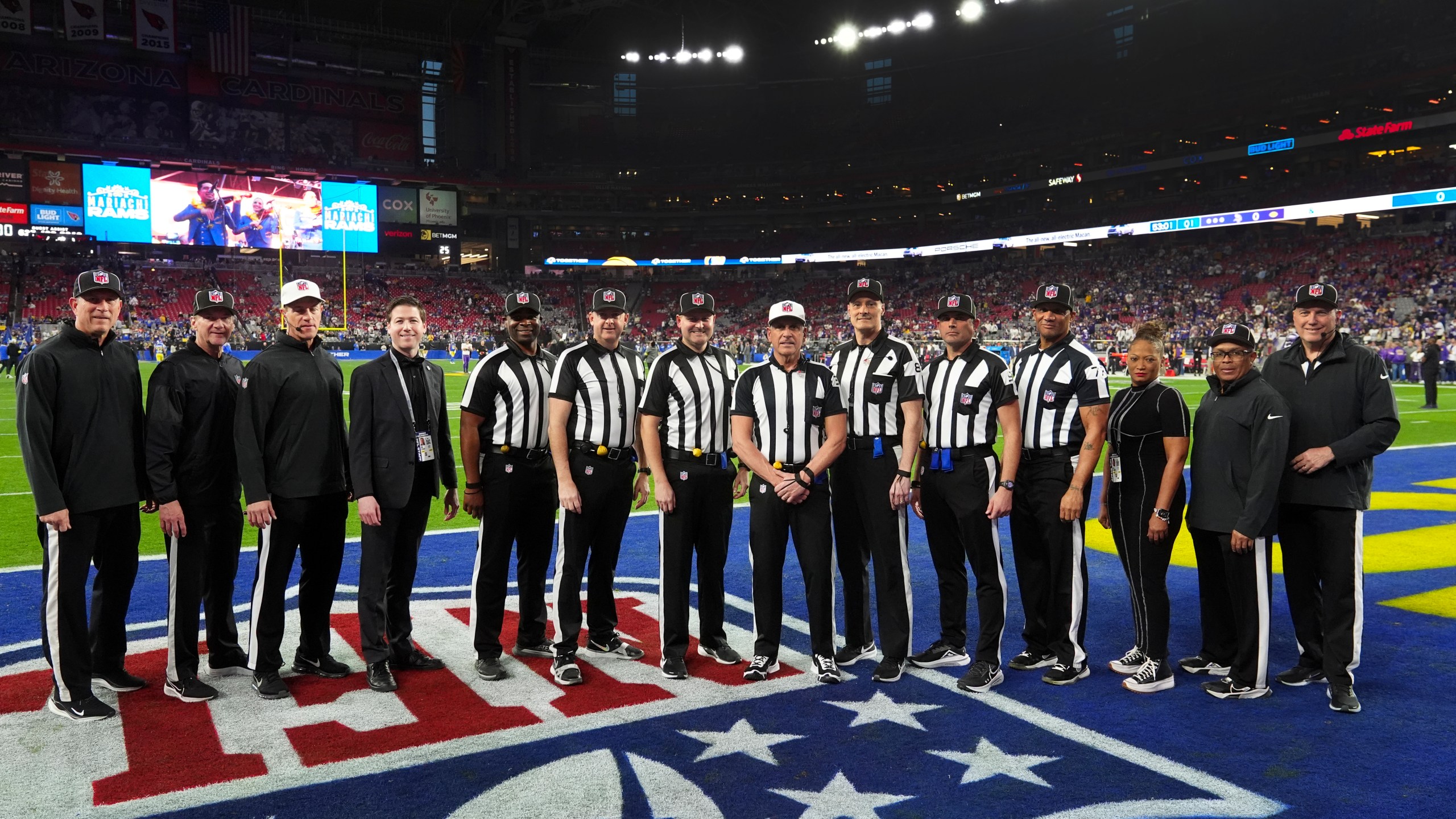 Officials including side judge Eugene Hall; side judge Allen Baynes; back judge Tony Josselyn; referee John Hussey; down judge Dana McKenzie; back judge Matt Edwards and umpire Terry Killens pose before an NFL wild card playoff football game between the Los Angeles Rams and Minnesota Vikings, Monday, Jan. 13, 2025, in Glendale, Ariz. (AP Photo/Ross D. Franklin)