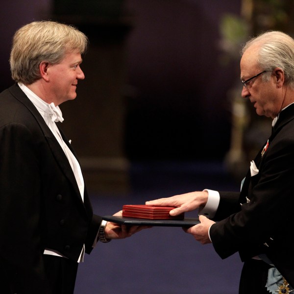 FILE - The 2011 Nobel Prize Laureate for Physics Dr Brian P. Schmidt from Australia receives his Nobel Prize from Sweden's King Carl XVI Gustaf, right, during the Nobel Prize award ceremony at the Stockholm Concert Hall in Stockholm, Sweden, Dec. 10, 2011. (AP Photo/Matt Dunham, File)