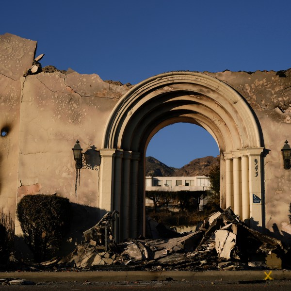 The facade of the Altadena Community Church stands amidst damage from the Eaton Fire on Monday, Jan. 13, 2025, in Altadena, Calif. (AP Photo/Carolyn Kaster)