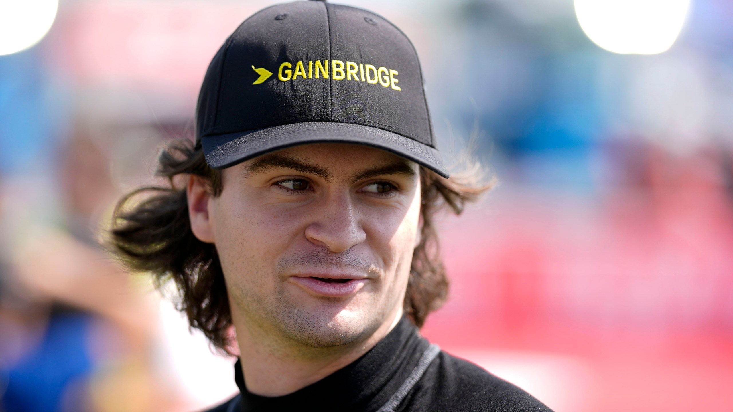 FILE - Colton Herta walks to driver introductions before an IndyCar auto race, Sunday, July 14, 2024, at Iowa Speedway in Newton, Iowa. (AP Photo/Charlie Neibergall, File)