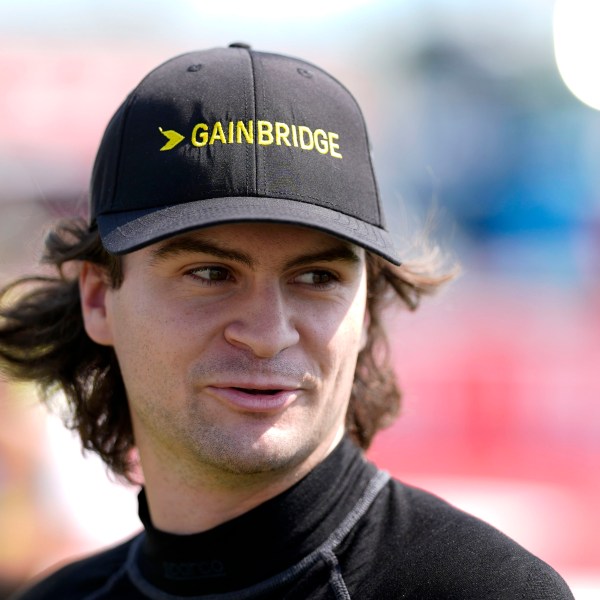 FILE - Colton Herta walks to driver introductions before an IndyCar auto race, Sunday, July 14, 2024, at Iowa Speedway in Newton, Iowa. (AP Photo/Charlie Neibergall, File)