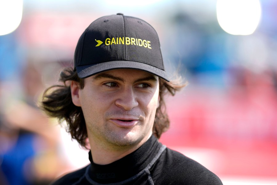 FILE - Colton Herta walks to driver introductions before an IndyCar auto race, Sunday, July 14, 2024, at Iowa Speedway in Newton, Iowa. (AP Photo/Charlie Neibergall, File)