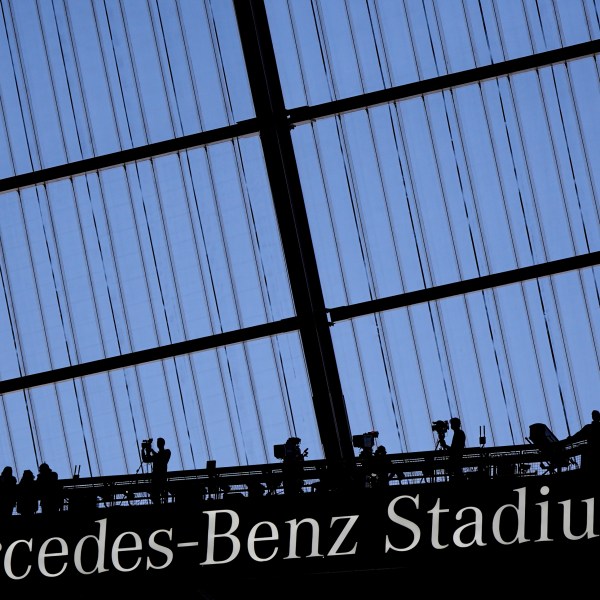 FILE - Fans watch an NFL football game at the Mercedes-Benz Stadium in Atlanta, Dec. 1, 2024. (AP Photo/Mike Stewart, File)