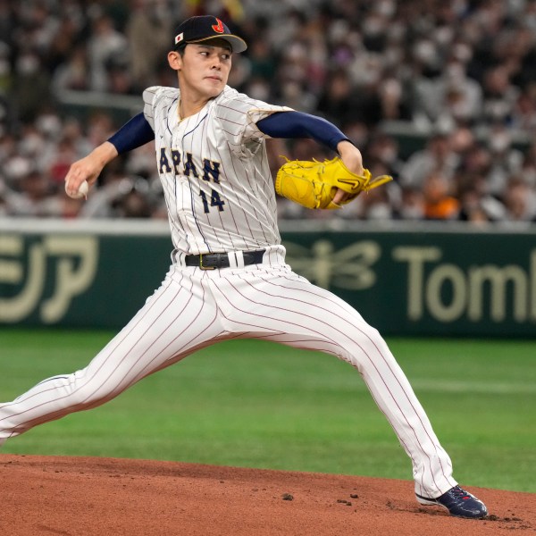 FILE - Japan's Roki Sasak pitches during a Pool B game against the Czech Republic at the World Baseball Classic at the Tokyo Dome, Japan, Saturday, March 11, 2023. (AP Photo/Eugene Hoshiko, File)