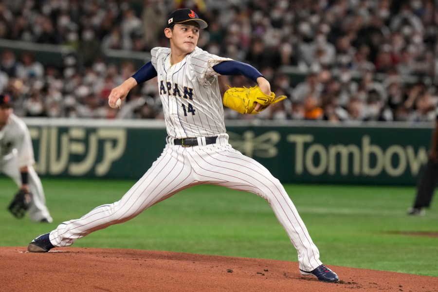 FILE - Japan's Roki Sasak pitches during a Pool B game against the Czech Republic at the World Baseball Classic at the Tokyo Dome, Japan, Saturday, March 11, 2023. (AP Photo/Eugene Hoshiko, File)