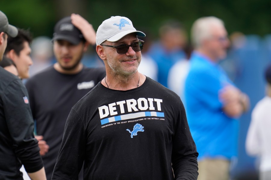 FILE - In this June 10, 2021, file photo, Chris Spielman, Detroit Lions special assistant to the chairman, watches during the team's NFL football practice in Allen Park, Mich. (AP Photo/Paul Sancya, File)