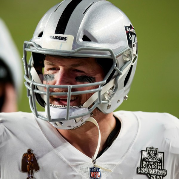 FILE - Las Vegas Raiders tight end Jason Witten (82) smiles as he walks off the field after a 32-31 win against the Denver Broncos in an NFL football game, Sunday, Jan.. 3, 2021, in Denver. (AP Photo/Justin Edmonds, file)