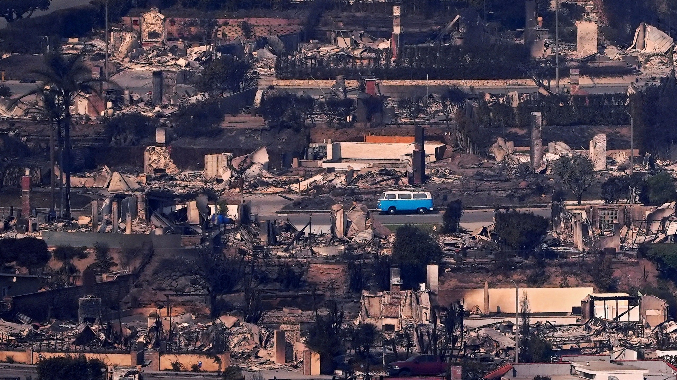 A VW van sits among burned out homes, Jan. 9, 2025, in Malibu, Calif. (AP Photo/Mark J. Terrill)