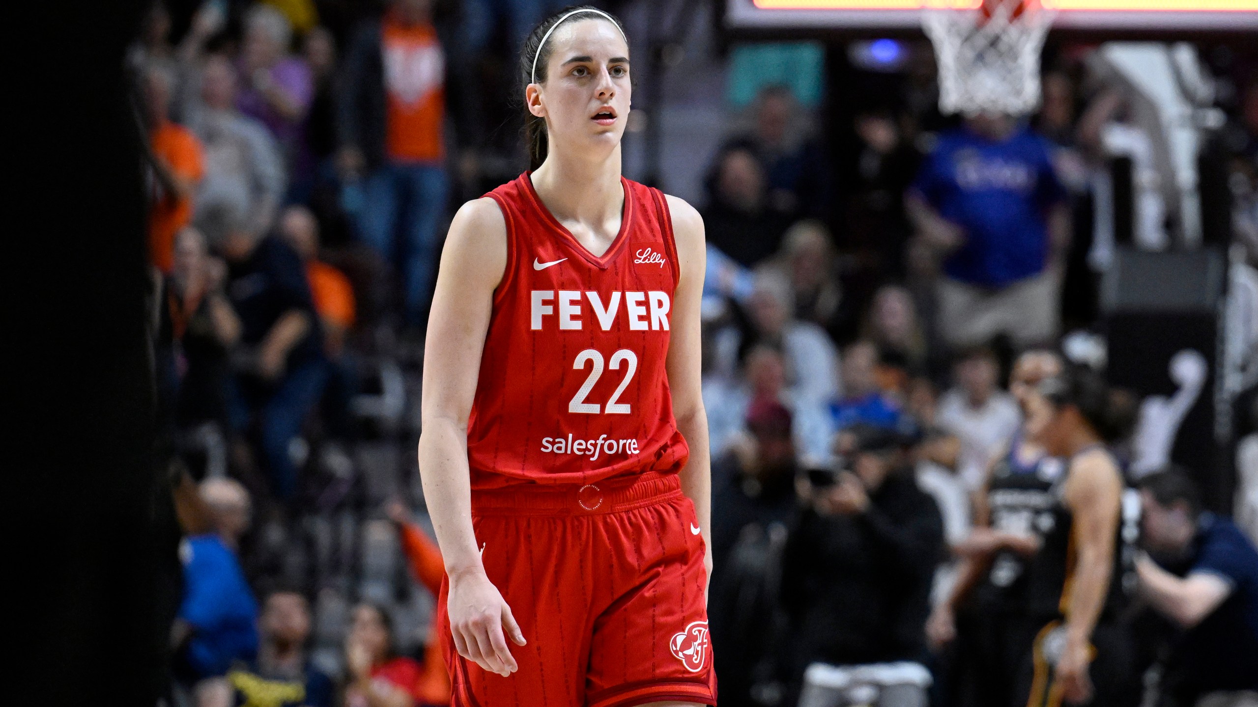 FILE - Indiana Fever guard Caitlin Clark (22) walks off the court after the Fever were eliminated by the Connecticut Sun in an WNBA basketball playoff game, Sept. 25, 2024, in Uncasville, Conn. (AP Photo/Jessica Hill, File)