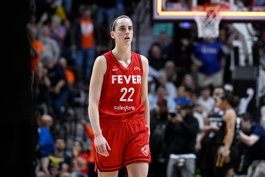 FILE - Indiana Fever guard Caitlin Clark (22) walks off the court after the Fever were eliminated by the Connecticut Sun in an WNBA basketball playoff game, Sept. 25, 2024, in Uncasville, Conn. (AP Photo/Jessica Hill, File)