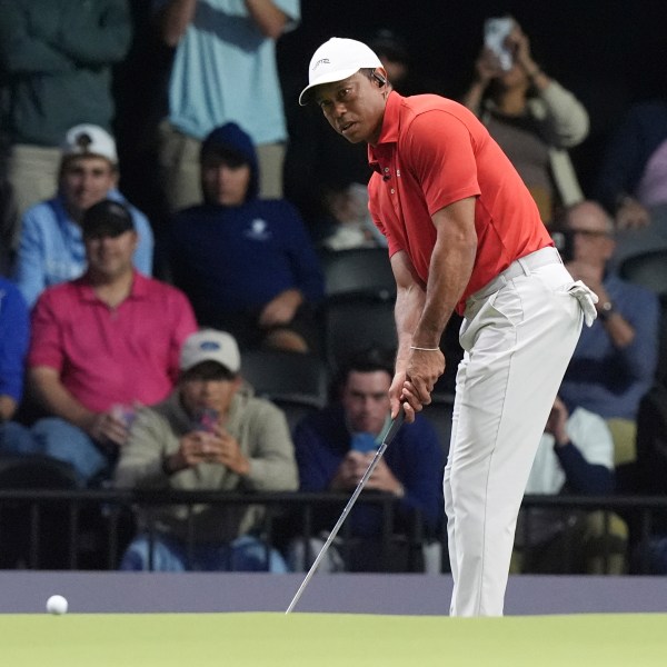 Tiger Woods of the Jupiter Links Golf Club putts on the 10 green during a match against the Los Angeles Golf Club, Tuesday, Jan. 14, 2025, in Palm Beach Gardens, Fla. (AP Photo/Marta Lavandier)